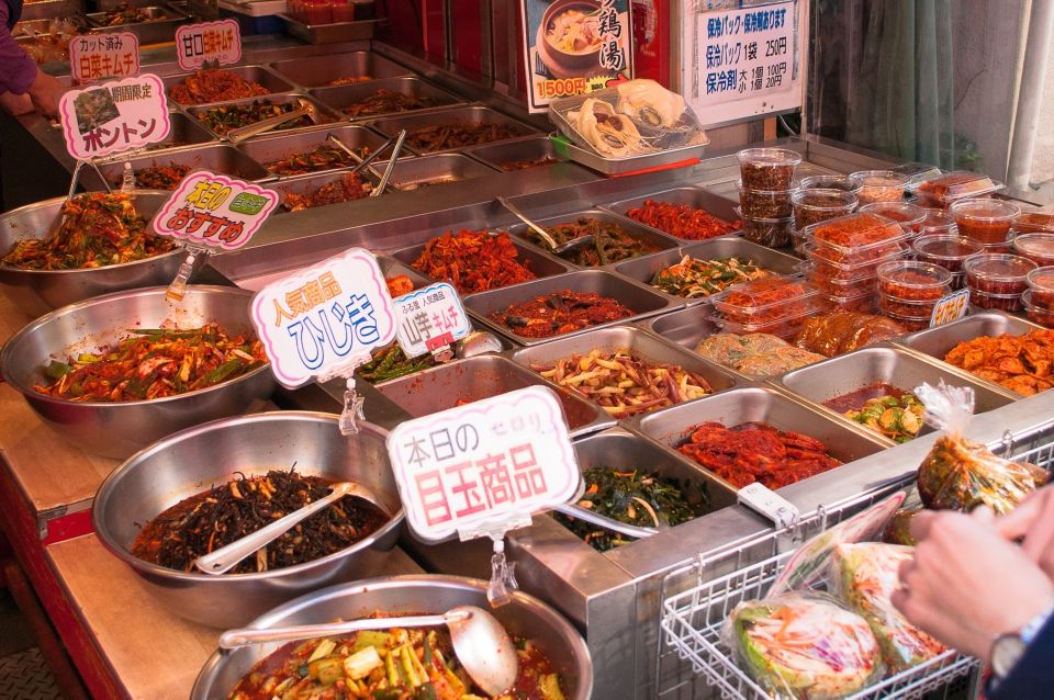 Osaka: Main Sights and Hidden Spots Guided Walking Tour - Dotonbori and Kuromon Markets: Foodie Paradise